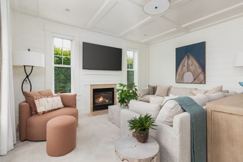 Living Room: Sunlit retreat with rustic charm, perfect for relaxing by the fireplace.
