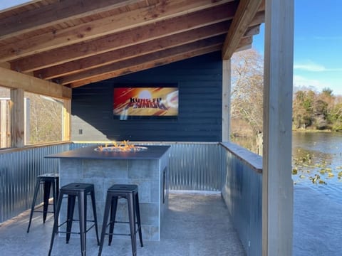 Outdoor Entertainment: Gather around the fire pit and enjoy movie nights by the water.
