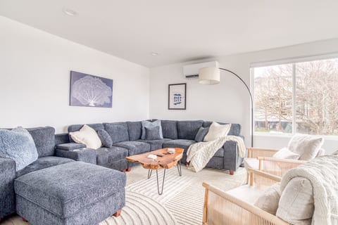 Living Room Retreat: Bright and airy space with plush seating and a view for memorable gatherings!