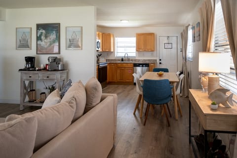 2BR – Open living space with sofas, dining for four and full kitchen – minutes from the sand