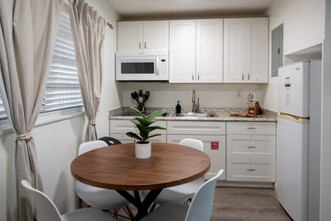Full kitchen with dining table for four