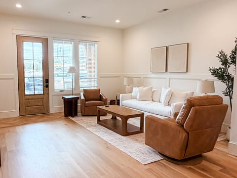 Bright, stylish living room with cozy seating and abundant natural light