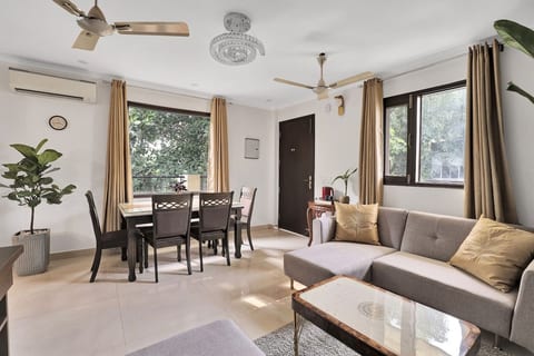 Relax in a beautifully designed living & dining area featuring plush seating, elegant interiors, & refreshing garden views. A perfect blend of comfort & sophistication for a relaxing stay.