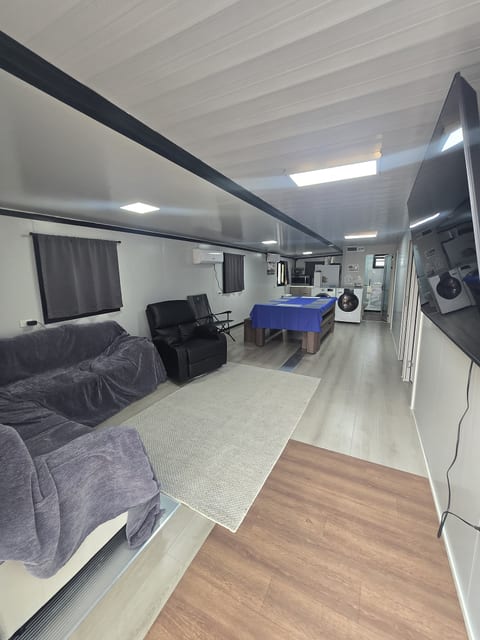 Spacious open-plan lounge and kitchen with comfy seating and dining area