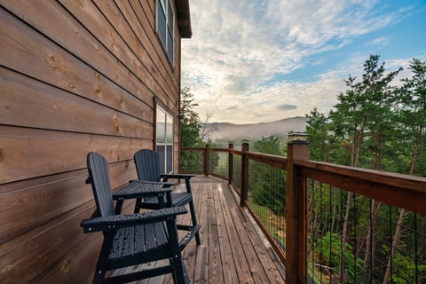 As the sun rises over the Smokies, this quiet corner of the deck becomes the best seat in the house.