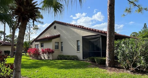 Beautiful Sarasota villa in a quiet tropical setting with a screened lanai for comfortable outdoor living. Surrounded by palm trees and lush landscaping, this peaceful retreat offers privacy and relaxation just minutes from beaches and attractions.