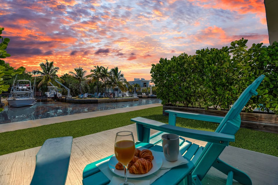 Nestled in a charming row of six waterfront retreats, Cabana 3 glows under the Key Largo sunset. Watch boats drift down calm canal waters from bright turquoise patio chairs made for evening drinks.