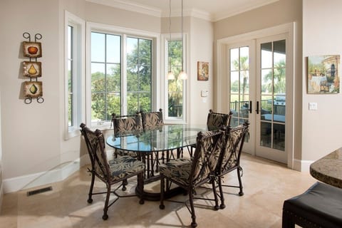One of four possible places for people to dine... bar stools, breakfast area, dining room, and balcony