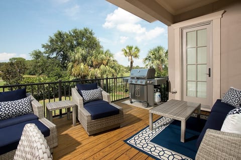 Weber grill, lots of seating and dining table are all available on this deck