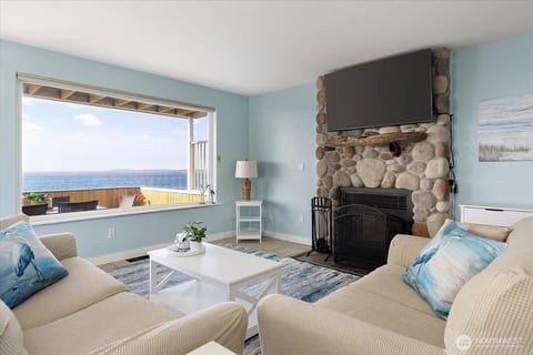 Living room with wood burning fireplace