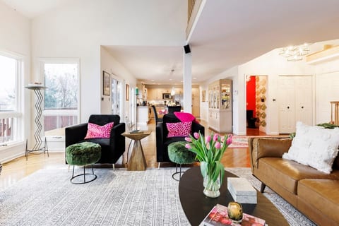 Relax in our bright living room with views of Onondaga lake and the city lights