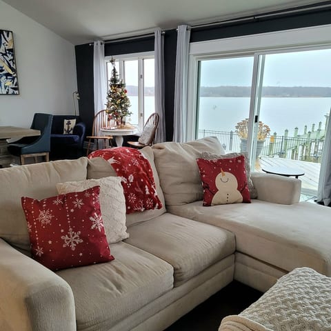 Enjoy a cozy waterfront Christmas in front of the fireplace