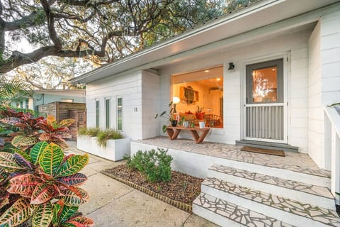 Charming entrance with vibrant landscaping