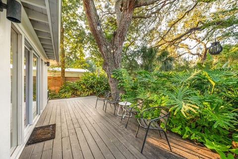 Serene deck surrounded by lush greenery
