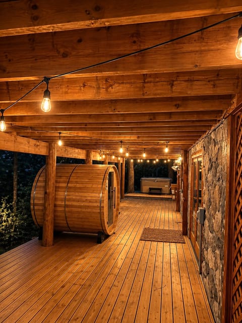Downstairs deck with sauna and spa located off of the 2nd living room and bar.
