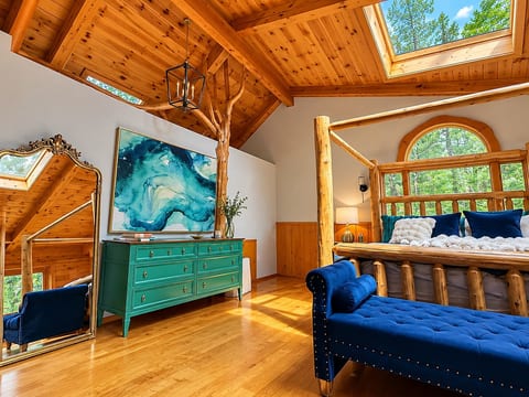 Primary Bedroom on top floor with private balcony and luxury bathroom.