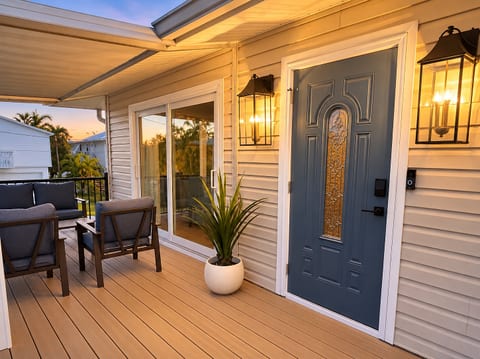 Inviting covered porch with sunset views and cozy outdoor seating
