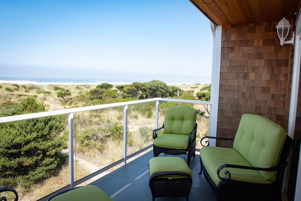 Upper deck with 2 cozy chairs w/ottomans & loveseat, and charcoal grill