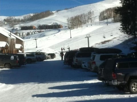 View from side door: West Wall Lift at other end of flat walk thru parking lot