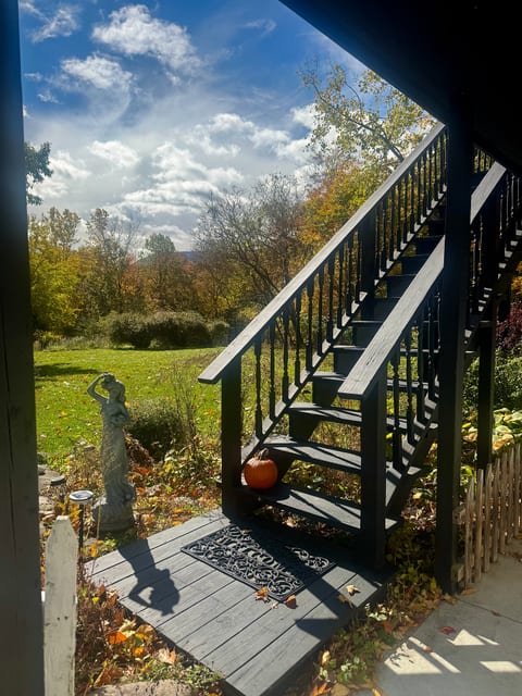 Charming private entry with garden views, open yard, and peaceful outdoor setting