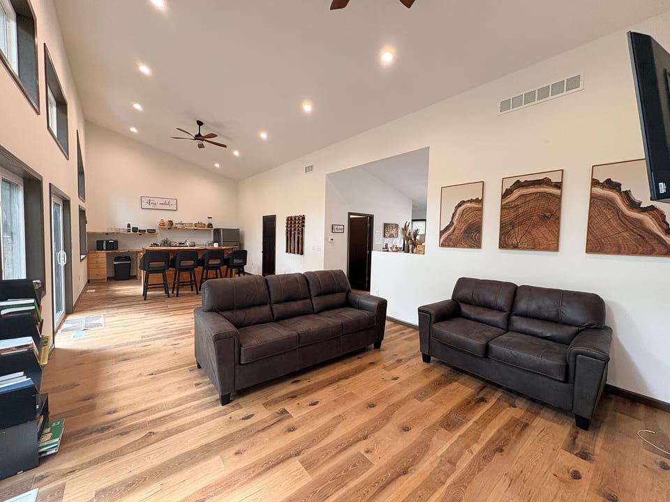 Bright, open living room with plenty of space to relax and gather together.”