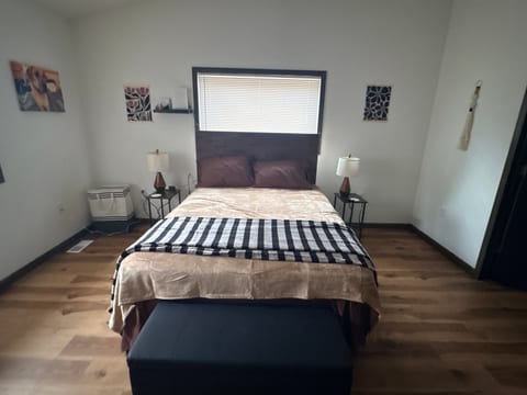 Spacious primary bedroom with a queen bed and private en-suite bathroom.