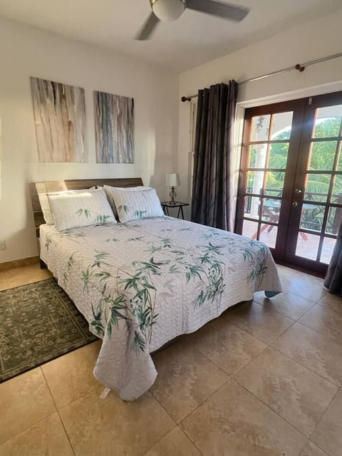 Sunny Master bedroom with queen bed