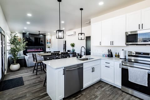Enjoy cooking in our modern kitchen with stainless steel appliances, quartz countertops, and all the cookware and tools you need.