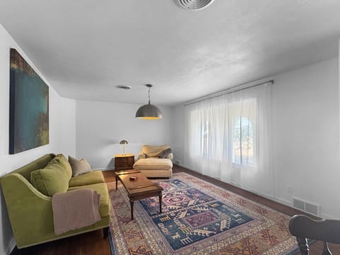 The second living area has been updated with a large screen mounted television and additional seating.