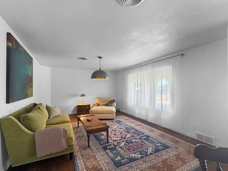 The second living area has been updated with a large screen mounted television and additional seating.