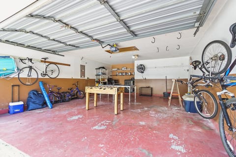 Garage game room. w/foosball table, pingpong, easel for kids