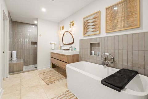 Ensuite master bathroom with large walk in shower, soaking tub and a separate water closet. Dimmer controlled lighting and vent fans. 