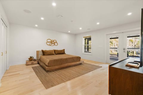 8' long closet is on left hand side with lighting and separate audio | visual | internet router. (High speed AT&T fiber). Two nightstand tables, and as previously mentioned, blackout shade in window and privacy shades in French doors.