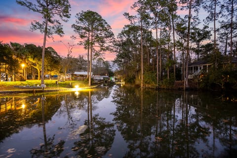 Peaceful canal-front retreat with glowing sunset views