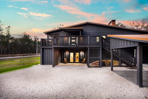 Modern two-level retreat with wrap around deck.