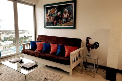 Living room with balcony and panoramic city view/ Living room with balcony and panoramic city view