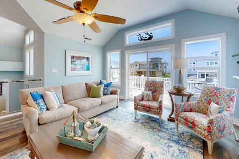 Enter the airy great room with beautiful flooring, lofty ceilings, and an electric fireplace that provides both ambiance and warmth. Thanks to the open design, you'll enjoy sweeping views from every corner of the top floor.