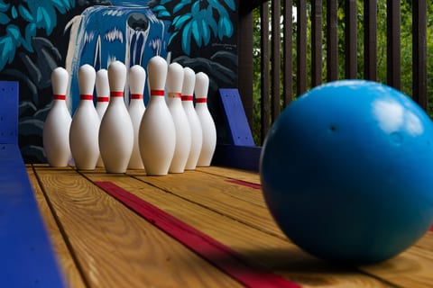 Unique outdoor mini bowling lane with tropical flair and family-friendly fun