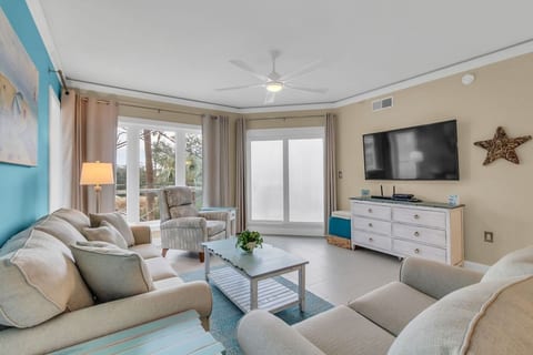 The spacious living area has a comfortable recliner and views from every window