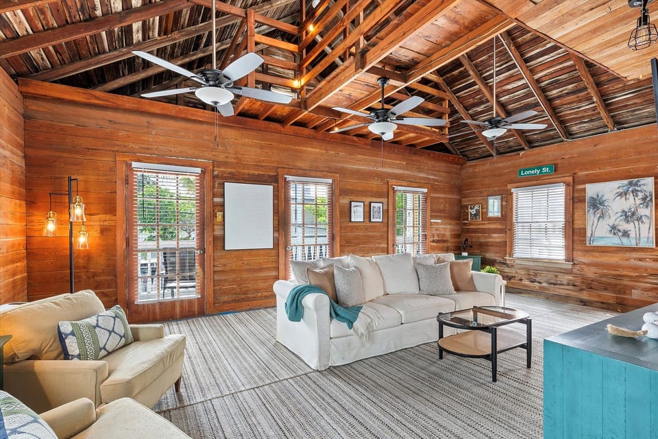 Bright living room with comfortable seating and historic Key West character