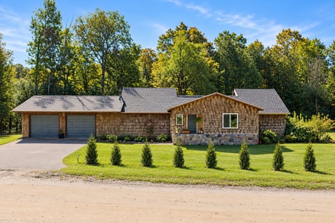 Front exterior of The Hideaway at Deer Creek, a peaceful vacation home in East Jordan, Michigan