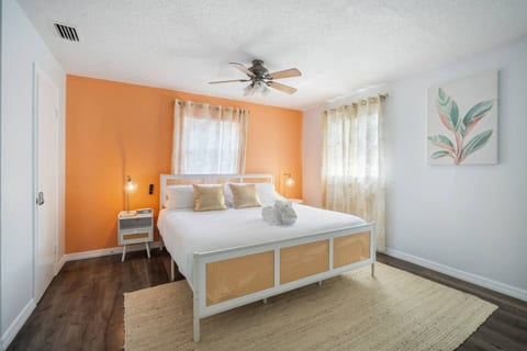 Bright, cozy bedroom with warm accents, natural light, and stylish decor