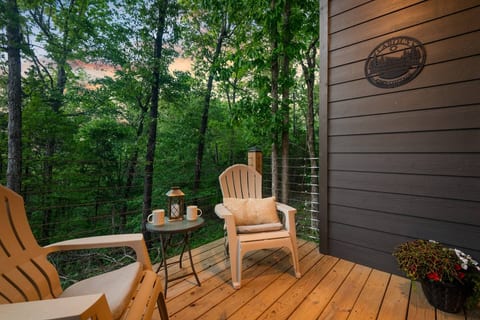 Peaceful forest-view deck with cozy seating for morning coffee