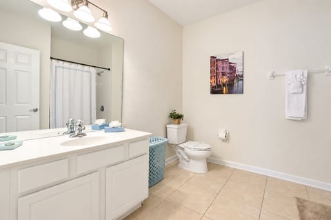 Bright, spacious bathroom with large vanity and clean modern style