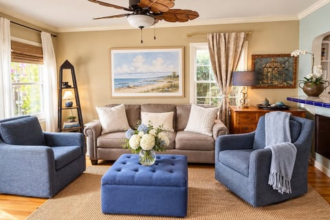 Inviting beachy living room with sofa sleeper swivel chairs that rock
60 inch HDTV