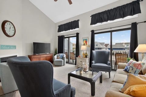 Bright and Airy Living Room opens to Deck