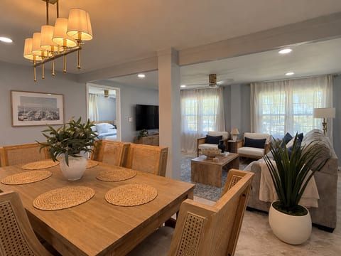 Bright open dining and living space with stylish coastal-inspired design