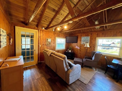 Living room with vaulted cabin ceilings