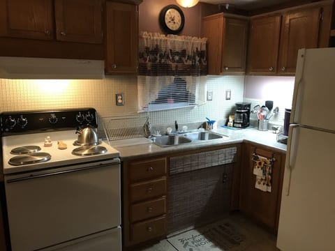 Kitchen stocked with dishes, pots, pans, appliances and all the essentials . . .