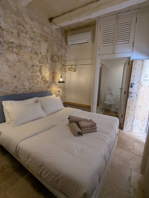 A private historic hideaway for one — walk to Mdina, breakfast included.